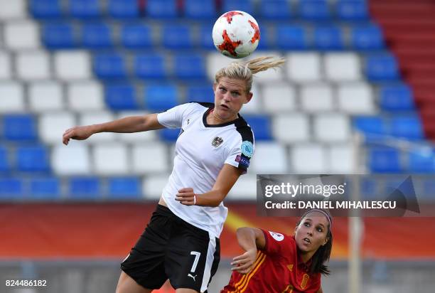 Carina Wenninger of Austria vies with Maria Paz of Spain during the UEFA Women's Euro 2017 quarter-final football match between Austria and Spain at...