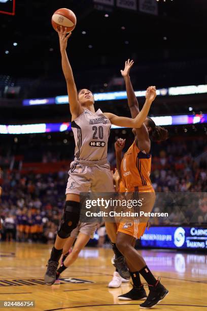 Isabelle Harrison of the San Antonio Stars attempts a lay-up shot against Angel Robinson of the Phoenix Mercury during the first half of the WNBA...