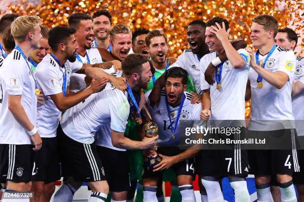 Emre Can of Germany lifts the trophy following the FIFA Confederations Cup Russia 2017 Final match between Chile and Germany at Saint Petersburg...