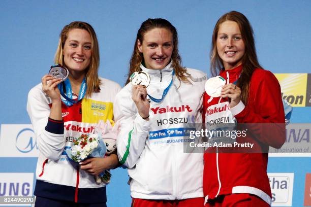 Silver medalist Mireia Belmonte of Spain gold medalist Katinka Hosszu of Hungary and bronze medalist Sydney Pickrem of Canada pose with the medals...