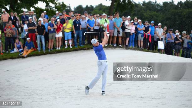 Alexander Knappe of Germany plays out of a bunker on the 6th fairway during the Porsche European Open - Day Four at Green Eagle Golf Course on July...