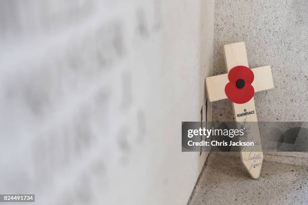 Cross rests within the Menin Gate next to the names of 50,000 lost soldiers at the Commonwealth War Graves Commission Ypres Memorial on July 30, 2017...