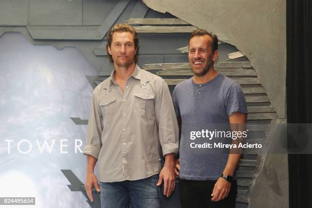 Actor Matthew McConaughey and filmmaker Nikolaj Arcel attend "The Dark Tower" photo call at the Whitby Hotel on July 30, 2017 in New York City.