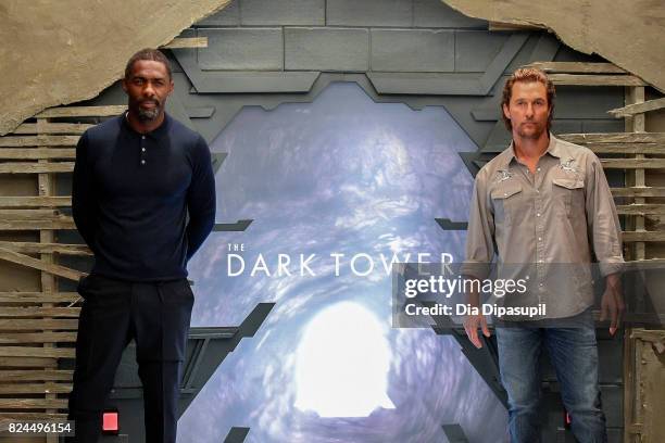 Idris Elba and Matthew McConaughey attend "The Dark Tower" photocall at the Whitby Hotel on July 30, 2017 in New York City.