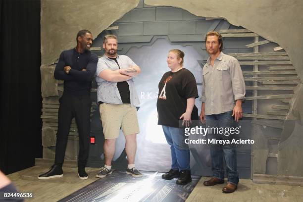 Actors Idris Elba, and actor Matthew McConaughey pose with fans at "The Dark Tower" photo call at the Whitby Hotel on July 30, 2017 in New York City.