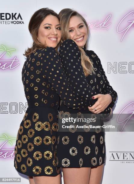 Actors Aubrey Plaza and Elizabeth Olsen arrive at the Los Angeles premiere of Neon's 'Ingrid Goes West' at ArcLight Hollywood on July 27, 2017 in...