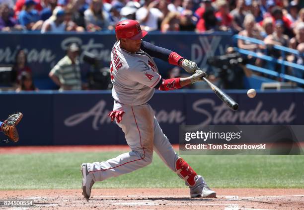 Yunel Escobar of the Los Angeles Angels of Anaheim hits an RBI double in the third inning during MLB game action against the Toronto Blue Jays at...