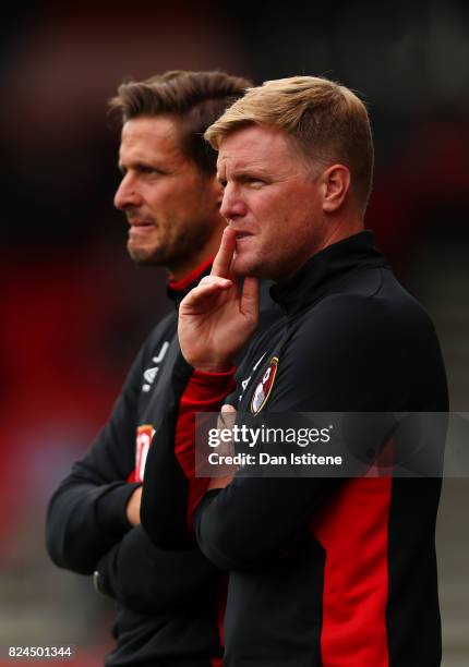 Eddie Howe, manager of AFC Bournemouth looks on from the touchline next to his assistant Jason Tindall during the pre-season friendly match between...