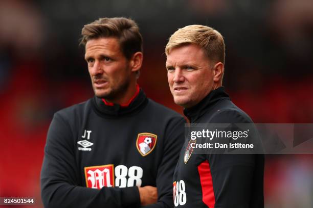 Eddie Howe, manager of AFC Bournemouth looks on from the touchline next to his assistant Jason Tindall during the pre-season friendly match between...