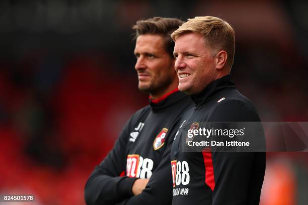 Eddie Howe, manager of AFC Bournemouth looks on from the touchline next to his assistant Jason Tindall during the pre-season friendly match between...