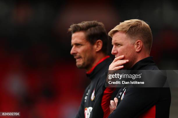 Eddie Howe, manager of AFC Bournemouth looks on from the touchline next to his assistant Jason Tindall during the pre-season friendly match between...