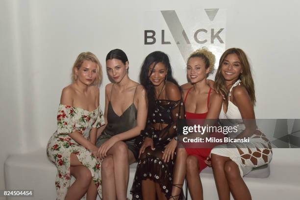 Lottie Moss, Vittoria Ceretti, Chanel Iman, Rose Bertram and Heidy De La Rosa pose for a photo during the Velocity Black party on July 29, 2017 in...