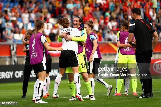 Verena Aschauer of Austria and Jasmin Pfeiler of Autria celebrate victory together after the UEFA Women's Euro 2017 Quarter Final match between...