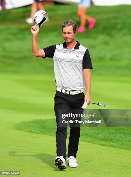 Jens Fahrbring of Sweden walks on to the 18th green during the Porsche European Open - Day Four at Green Eagle Golf Course on July 30, 2017 in...