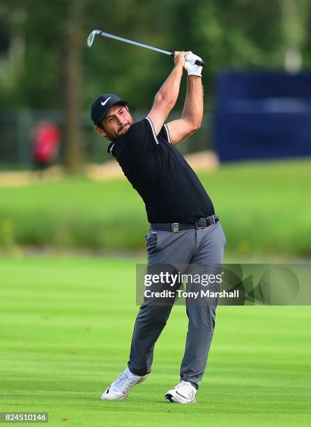 Alexander Levy of France plays his second shot on the first play off hole during the Porsche European Open - Day Four at Green Eagle Golf Course on...