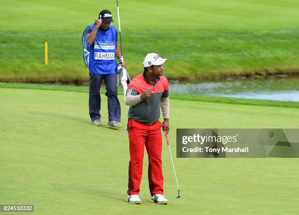 Siddikur Rahman of Bangladesh celebrates finishing his round on the 18th green during the Porsche European Open - Day Four at Green Eagle Golf Course...