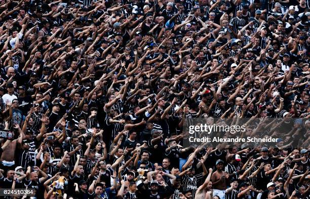 Fans of Corinthians cheer during the match between Corinthians and Flamengo for the Brasileirao Series A 2017 at Arena Corinthians Stadium on July...