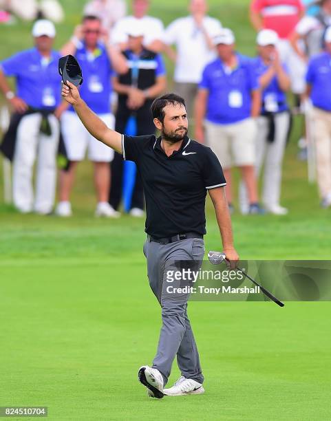 Alexander Levy of France walks on to the 18th green during the Porsche European Open - Day Four at Green Eagle Golf Course on July 30, 2017 in...