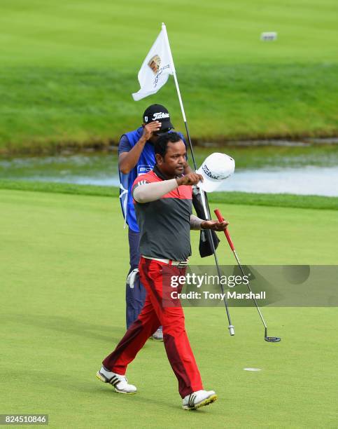 Siddikur Rahman of Bangladesh finishes his round on the 18th green during the Porsche European Open - Day Four at Green Eagle Golf Course on July 30,...