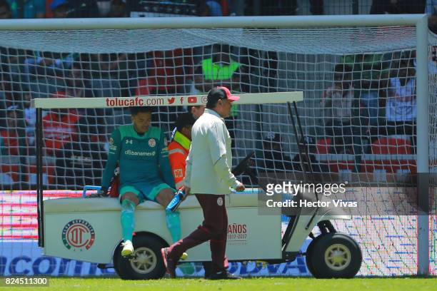 Alfredo Talavera goalkeeper of Toluca leaves the field after being injured during the 2nd round match between Toluca and Leon as part of the Torneo...