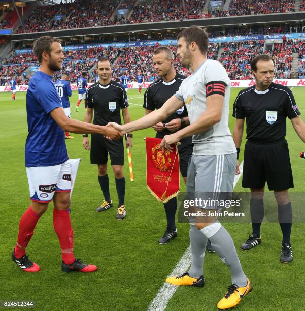 Michael Carrick of Manchester United shakes hands with the Valerenga Captain prior to the pre-season friendly match between Valerenga and Manchester...