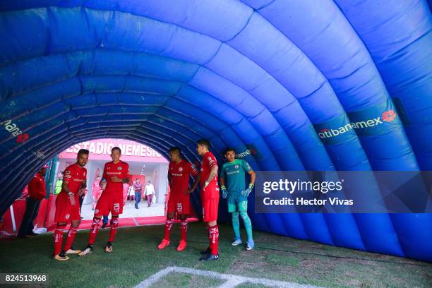 Players of Toluca walk onto the field prior the 2nd round match between Toluca and Leon as part of the Torneo Apertura 2017 Liga MX at Nemesio Diez...