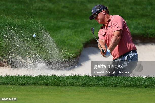 Charley Hoffman of the United States plays his shot out of the bunker on the ninth hole during the final round of the RBC Canadian Open at Glen Abbey...
