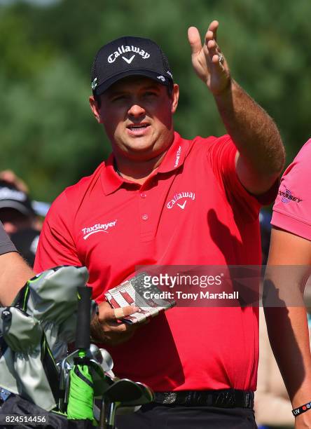 Patrick Reed of the United States looks at the line of his firt shot on the 1st tee during the Porsche European Open - Day Four at Green Eagle Golf...