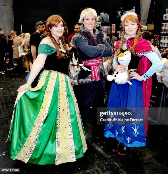 Cosplayers dressed as Disney's Princess Anna with Kristoff of Frozen attend MCM Comic Con at Manchester Central on July 30, 2017 in Manchester,...