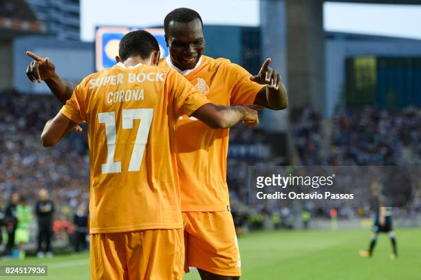 Corona of FC Porto celebrates with Aboubakar after scores the third goal during the Pre-Season Friendly match between FC Porto and RC Deportivo La...