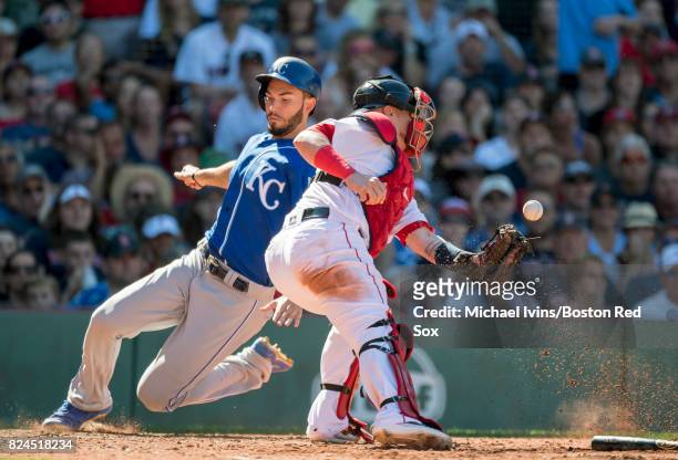 Eric Hosmer of the Kansas City Royals scores ahead of a throw to Christian Vazquez of the Boston Red Sox in the eighth inning on July 30, 2017 in...
