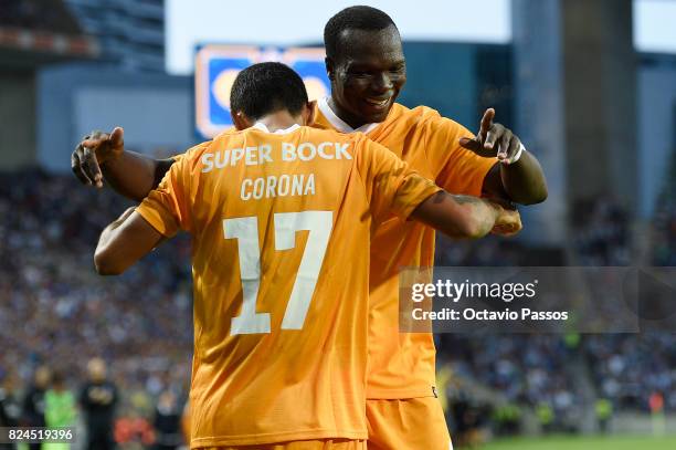 Corona of FC Porto celebrates with Aboubakar after scores the third goal during the Pre-Season Friendly match between FC Porto and RC Deportivo La...