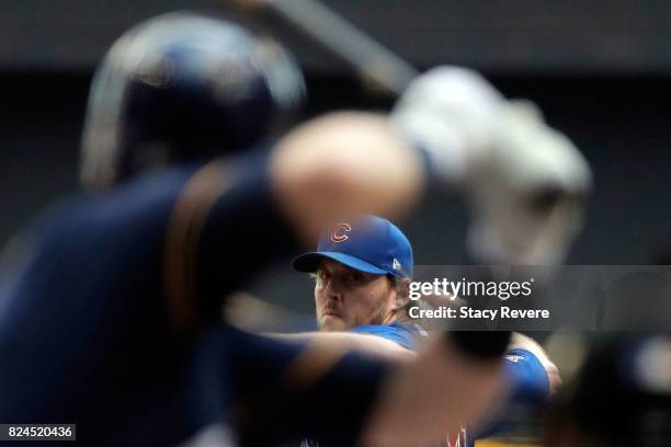 John Lackey of the Chicago Cubs throws a pitch during the sixth inning of a game against the Milwaukee Brewers at Miller Park on July 30, 2017 in...