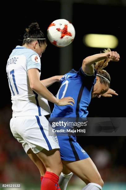 Jade Moore of England and Camille Abily of France battle to win a header during the UEFA Women's Euro 2017 Quarter Final match between France and...