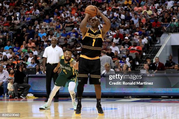 Chauncey Billups of the Killer 3s attempts a shot past Xavier Silas of the Ball Hogs during week six of the BIG3 three on three basketball league at...