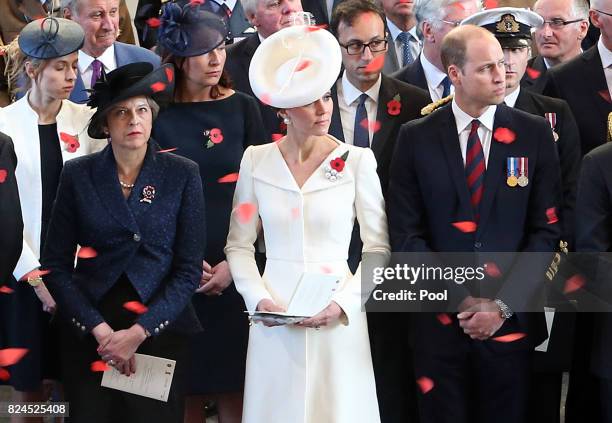 Prime Minister Theresa May , the Prince William, Duke of Cambridge and Catherine, Duchess of Cambridge watch as the poppies fall from the roof of the...