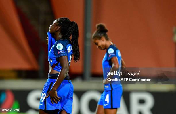 France's defender Griedge Mbock Bathy and France's defender Laura Georges react after losing the UEFA Women's Euro 2017 tournament quarter-final...