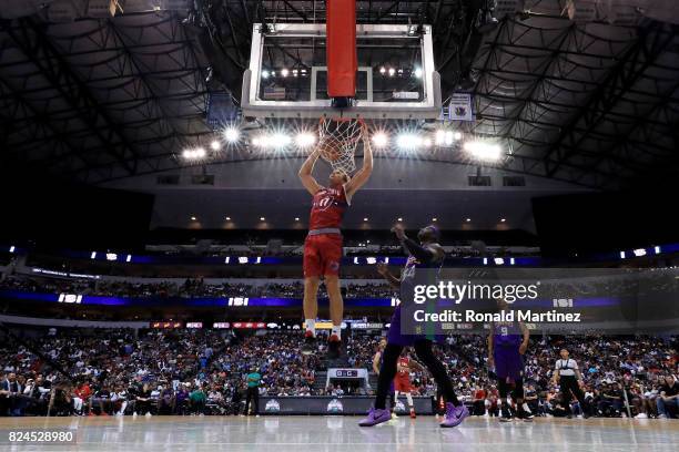 Lou Amundson of Tri-State dunks the ball past Kwame Brown of the 3 Headed Monsters during week six of the BIG3 three on three basketball league at...