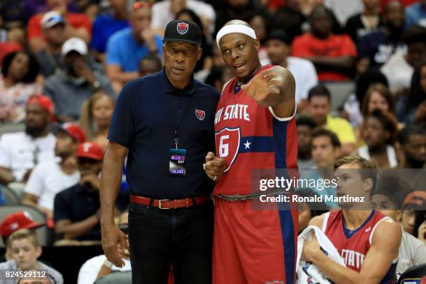 Coach Julius 'Dr. J' Erving of Tri-State meets with Bonzi Wells during the game against the 3 Headed Monsters during week six of the BIG3 three on...