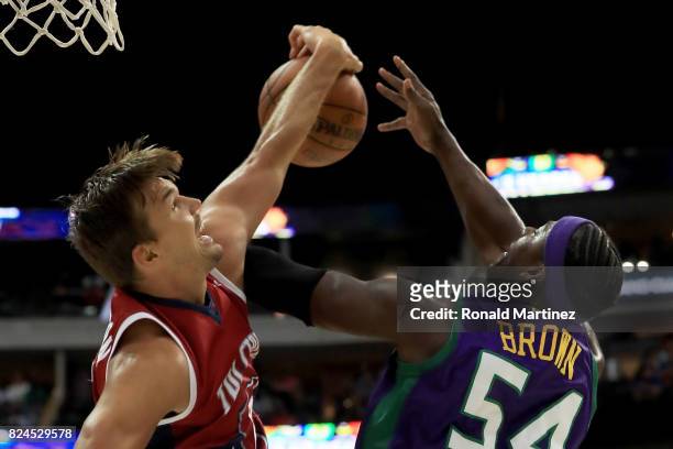Lou Amundson of Tri-State blocks a shot attempt by Kwame Brown of the 3 Headed Monsters during week six of the BIG3 three on three basketball league...
