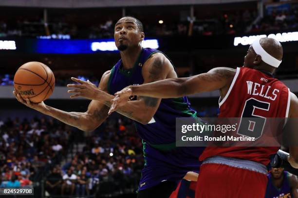 Rashard Lewis of the 3 Headed Monsters attempts a shot while being guarded by Bonzi Wells of Tri-State during week six of the BIG3 three on three...