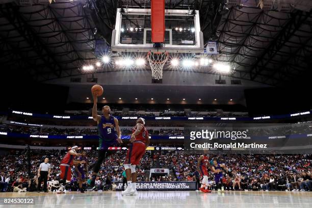 Rashard Lewis of the 3 Headed Monsters attempts a shot while being guarded by Bonzi Wells of Tri-State during week six of the BIG3 three on three...