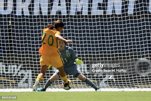 Sam Kerr of Australia scores a goal past Sakiko Ikeda of Japan during the first half of a match in the 2017 Tournament of Nations at Qualcomm Stadium...