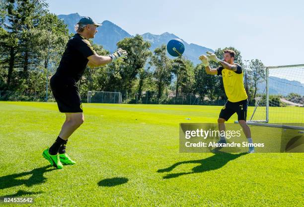 Wolfgang ÒTeddyÒ de Beer and goalkeeper Roman Buerki of Borussia Dortmund in action during a training session as part of the training camp on July...