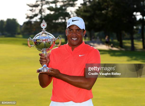 Jhonattan Vegas of Venezuela poses with the trophy following the final round of the RBC Canadian Open at Glen Abbey Golf Club on July 30, 2017 in...