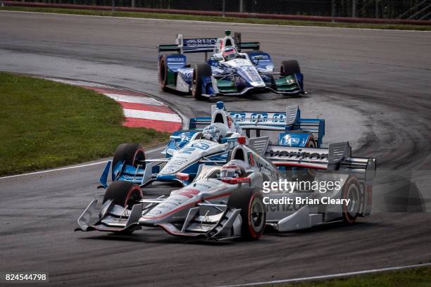 Will Power, of Australia, drives the Chevrolet IndyCar, ahead of Josef Newgarden in the Chevrolet IndyCar and Takuma Sato, of Japan, in the Honda...