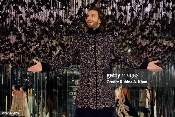 Bollywood actor Ranveer Singh walks for Manish Malhotra during FDCI's India Couture Week 2017 at the Taj Palace hotel on July 30, 2017 in New Delhi,...