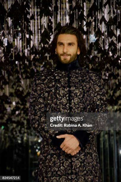 Bollywood actor Ranveer Singh walks for Manish Malhotra during FDCI's India Couture Week 2017 at the Taj Palace hotel on July 30, 2017 in New Delhi,...