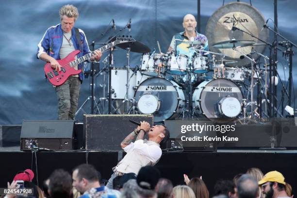 Ross Valory, Arnel Pineda and Steve Smith of Journey perform onstage during The Classic East - Day 2 at Citi Field on July 30, 2017 in New York City.