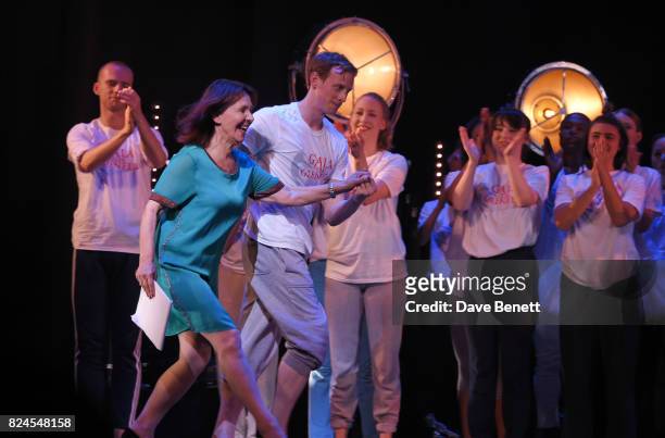 Director Arlene Phillips is led onstage by dancer Edward Watson at the curtain call during the 'Gala For Grenfell', bringing together a host of the...